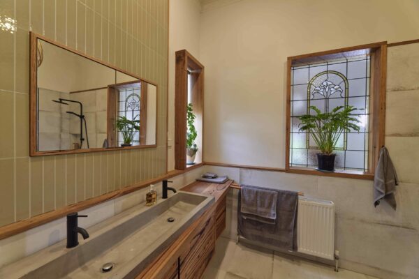 custom timber bathroom vanity with green tiles