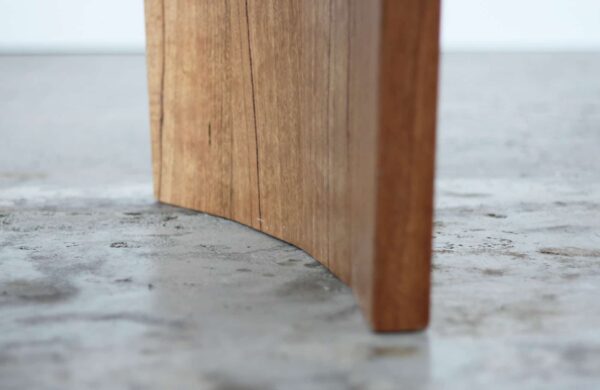 curved timber dining table leg detail