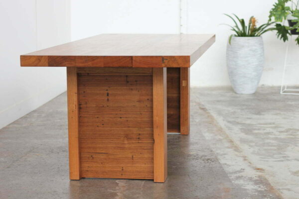 timber dining table with plants