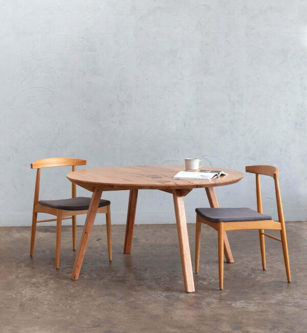 round timber dining table with chairs
