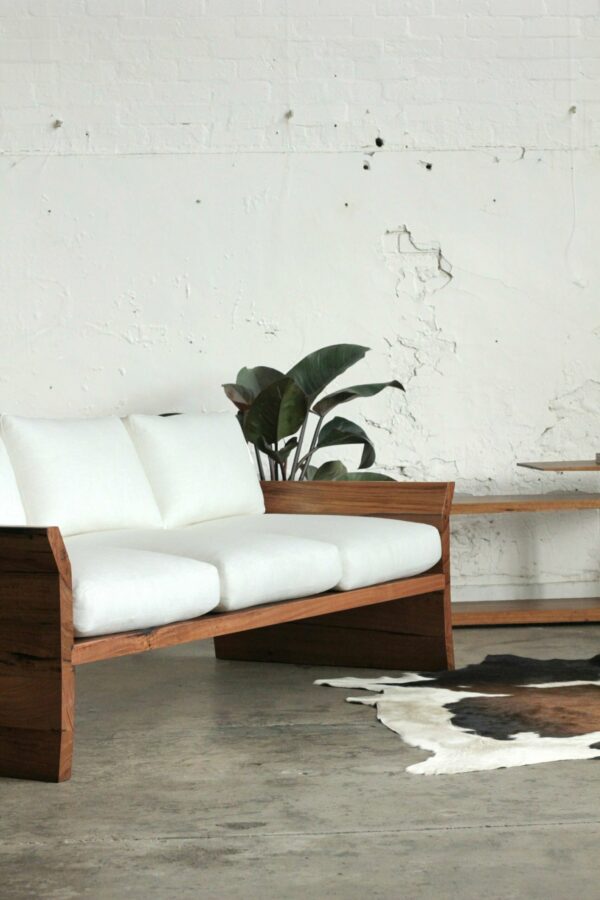 timber designer sofa with cushions