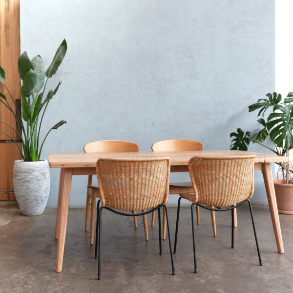 timber Scandinavian inspired dining table with rattan dining chairs