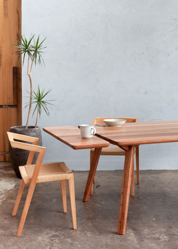 Jordan extendable dining table with teak and rattan dining chairs in Preston