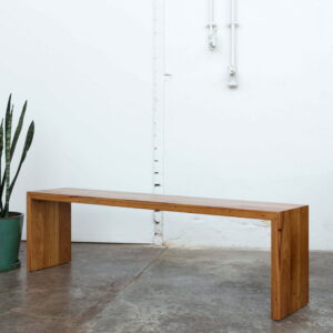 timber dining bench with snake plant