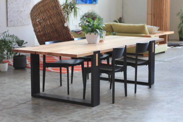 Timber dining table with black legs