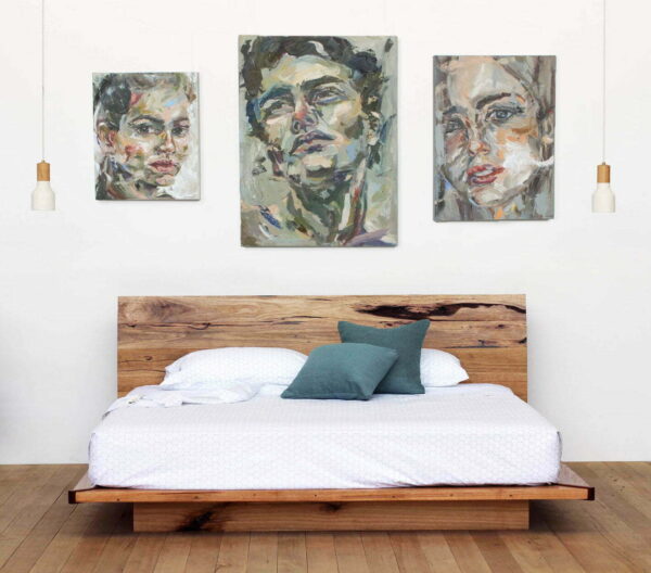 Timber platform bed with paintings