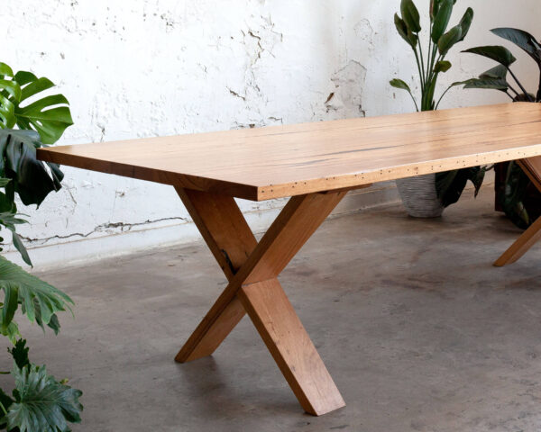 timber dining table with cross leg design