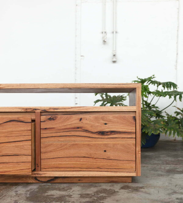 timber entertainment unit with plant