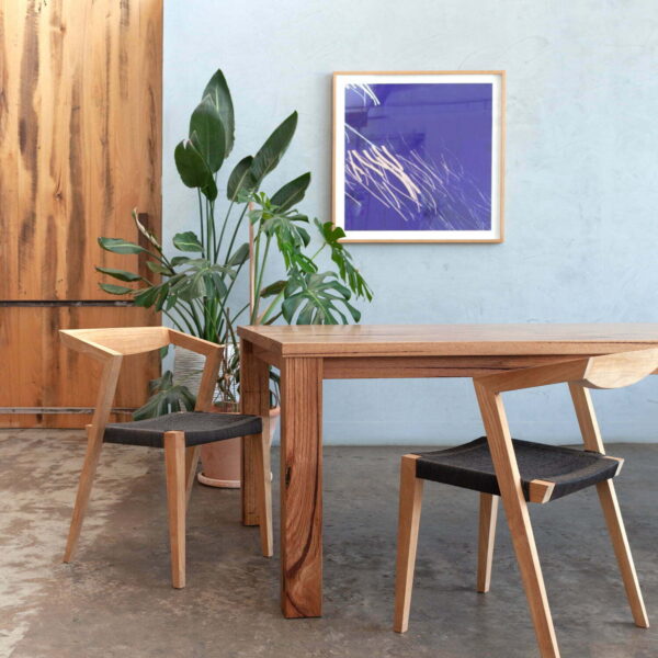 timber dining table with woven chairs
