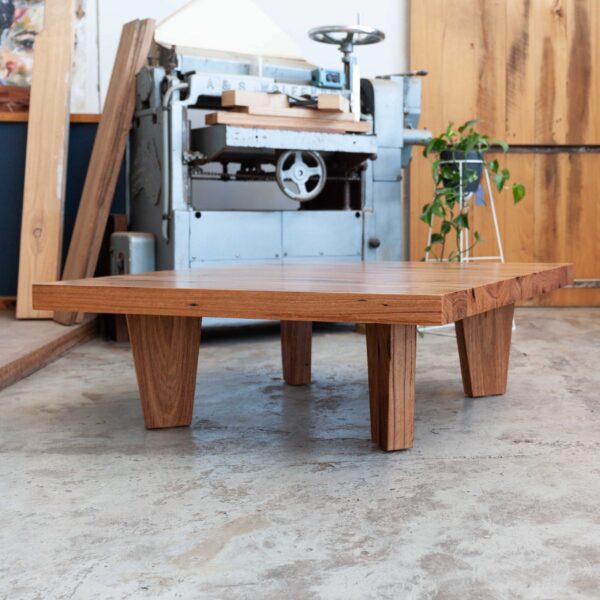 timber coffee table with plants