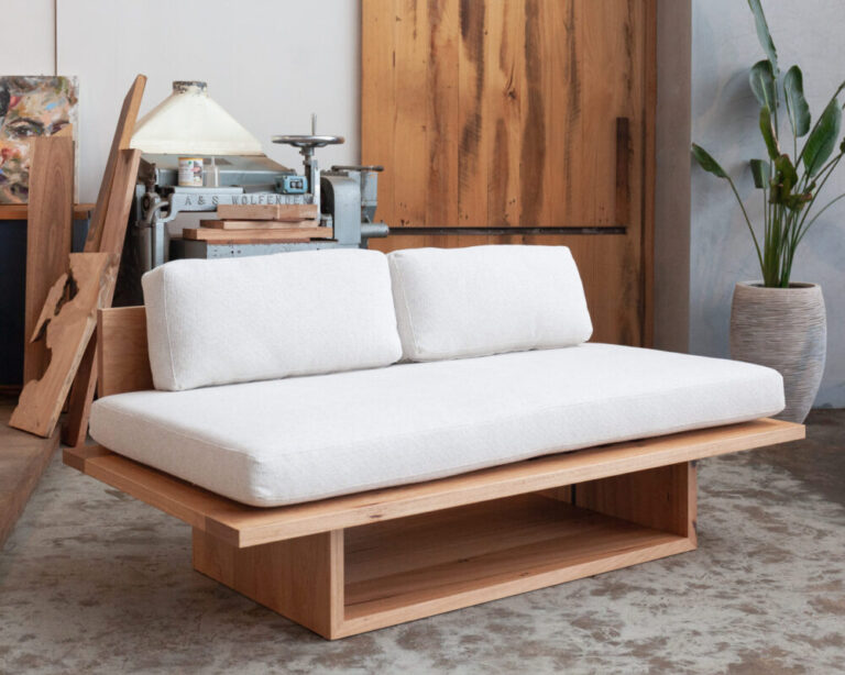 timber daybed with cream upholstery